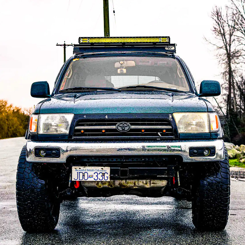 Front view of the Toyota 4runner with a roof rack and a light bar