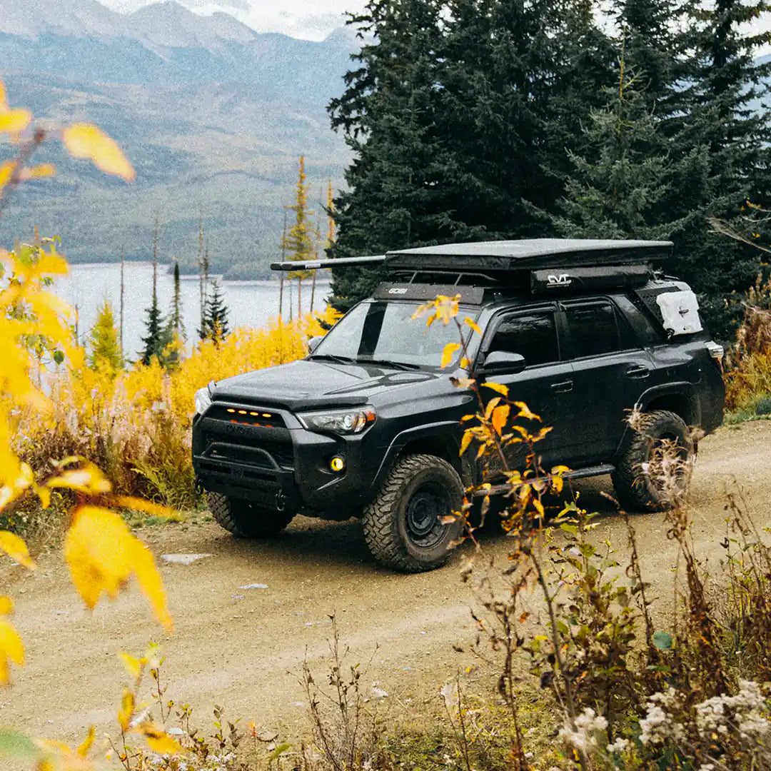 On a dirty road with a roof tent