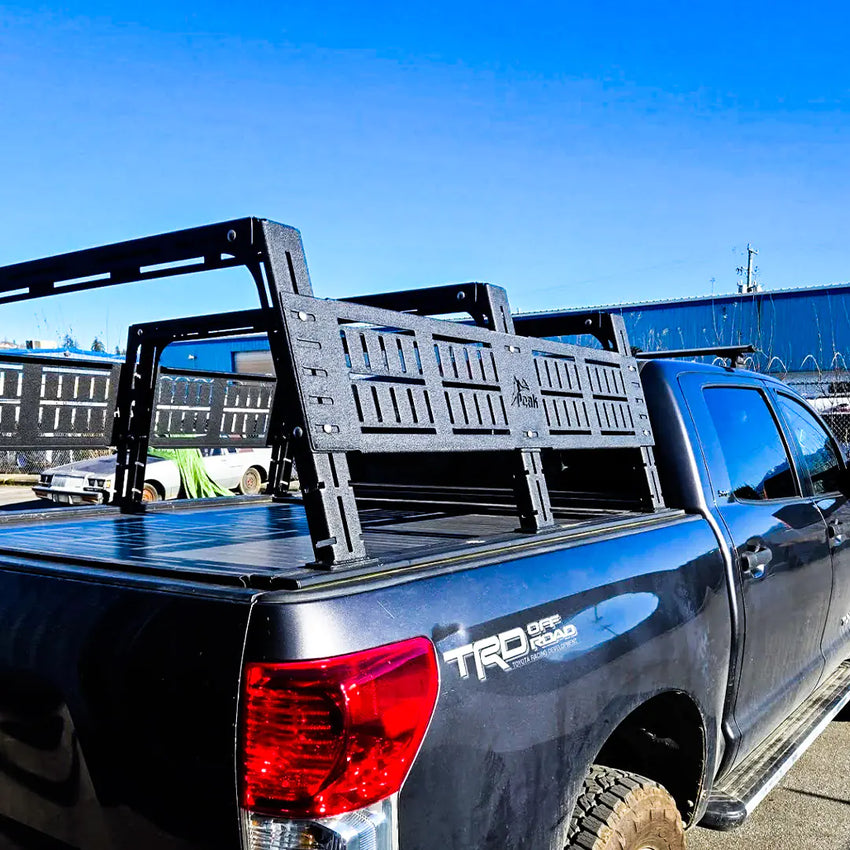 Rear view of the Adjustable Bed rack on a Toyota Tacoma with 3 crossbars