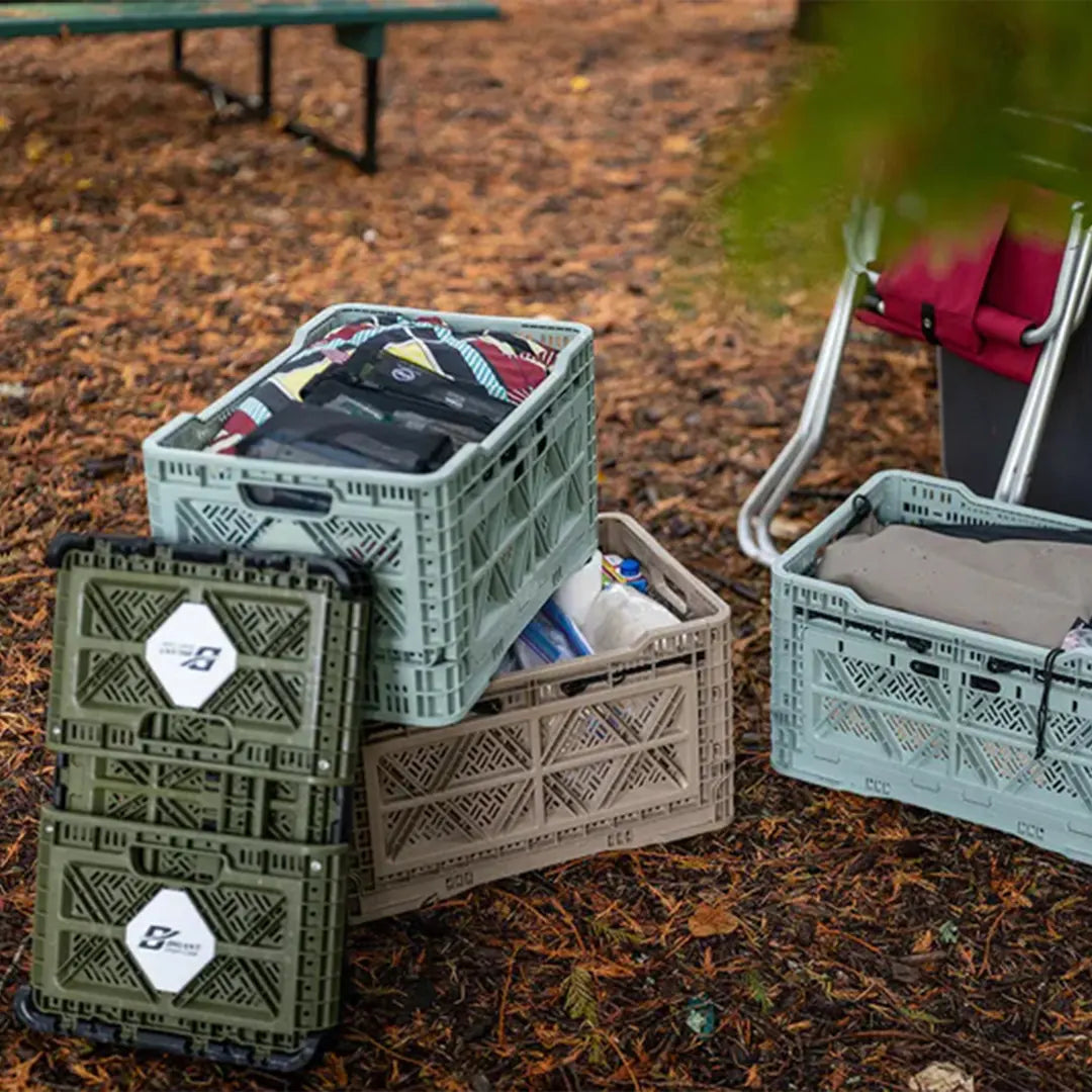 Crates in outdoor with clothes and camping stuff