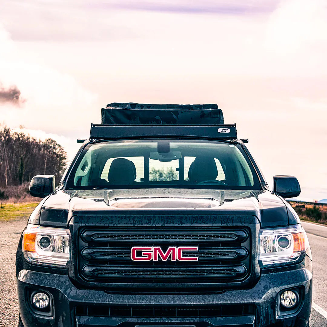 Front view of the GMC truck with a roof top tent