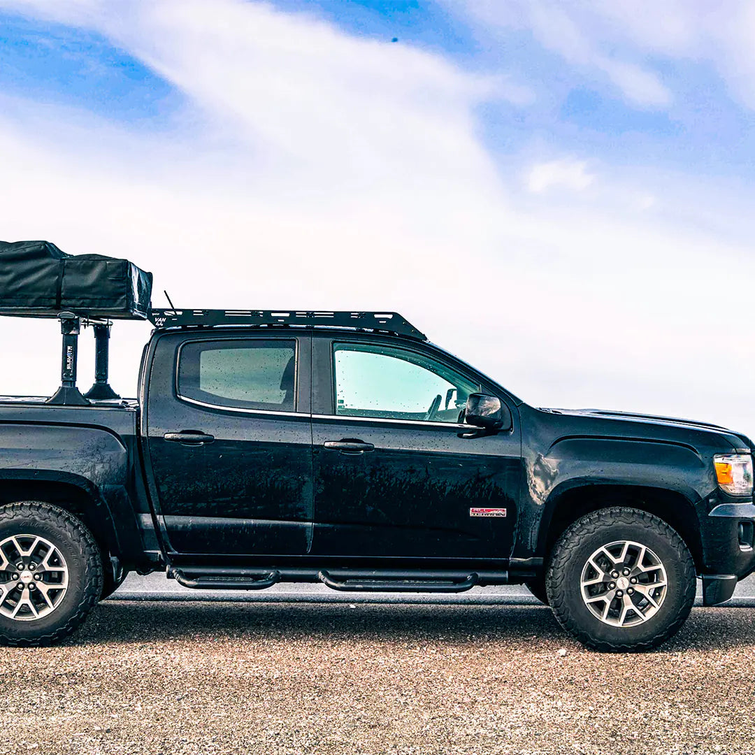 GMC Canyon with a roof rack and a roof top tent