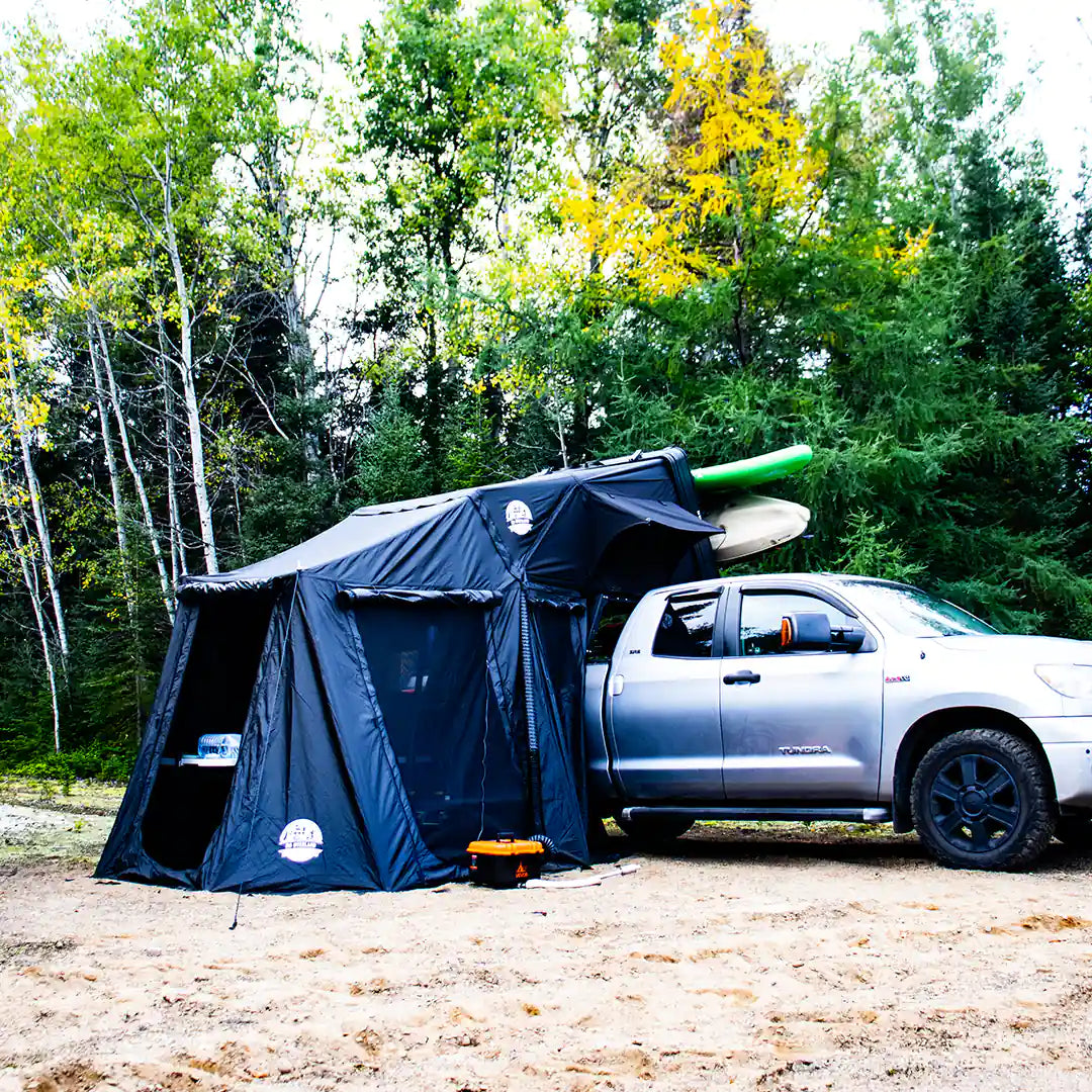 Large view of the diesel heater with the roof top tent and the air ducting system on a camping spot