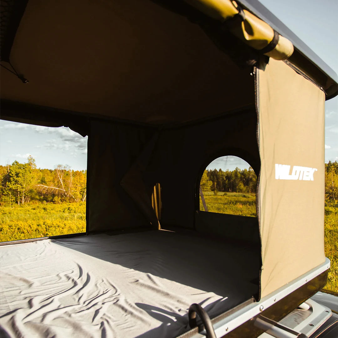 View of the inside of the pop up roof top tent by WildTek