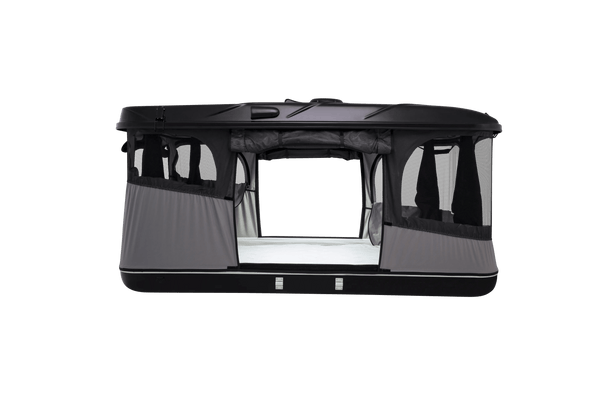 Side view of the black roof top tent with lights on and windows open