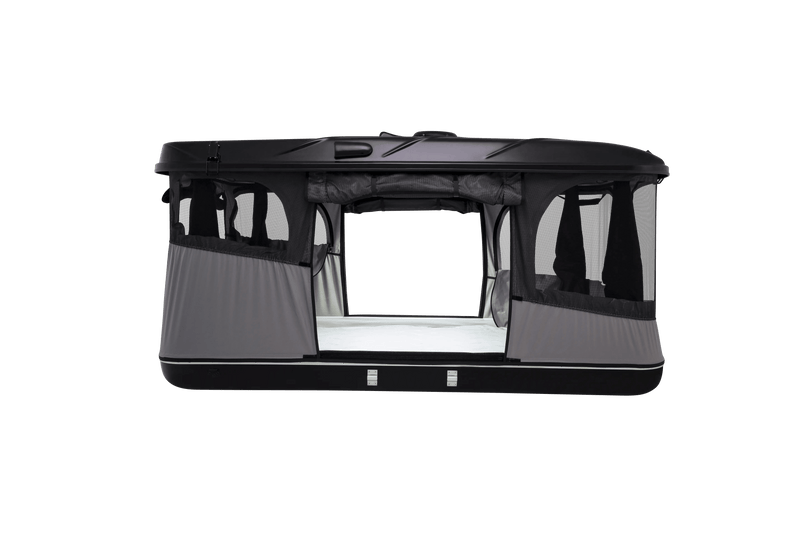 Side view of the black roof top tent with lights on and windows open