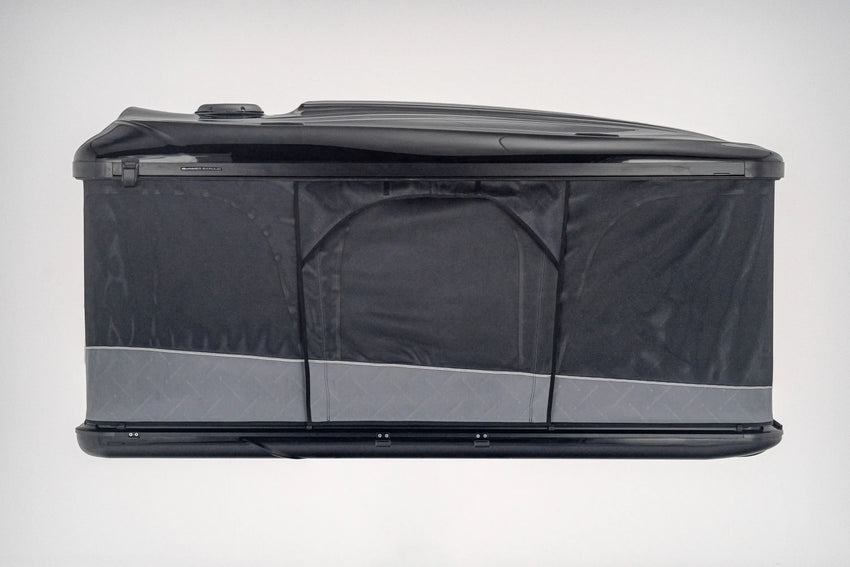 Side view of the black pop up roof top tent when doors and windows are closed