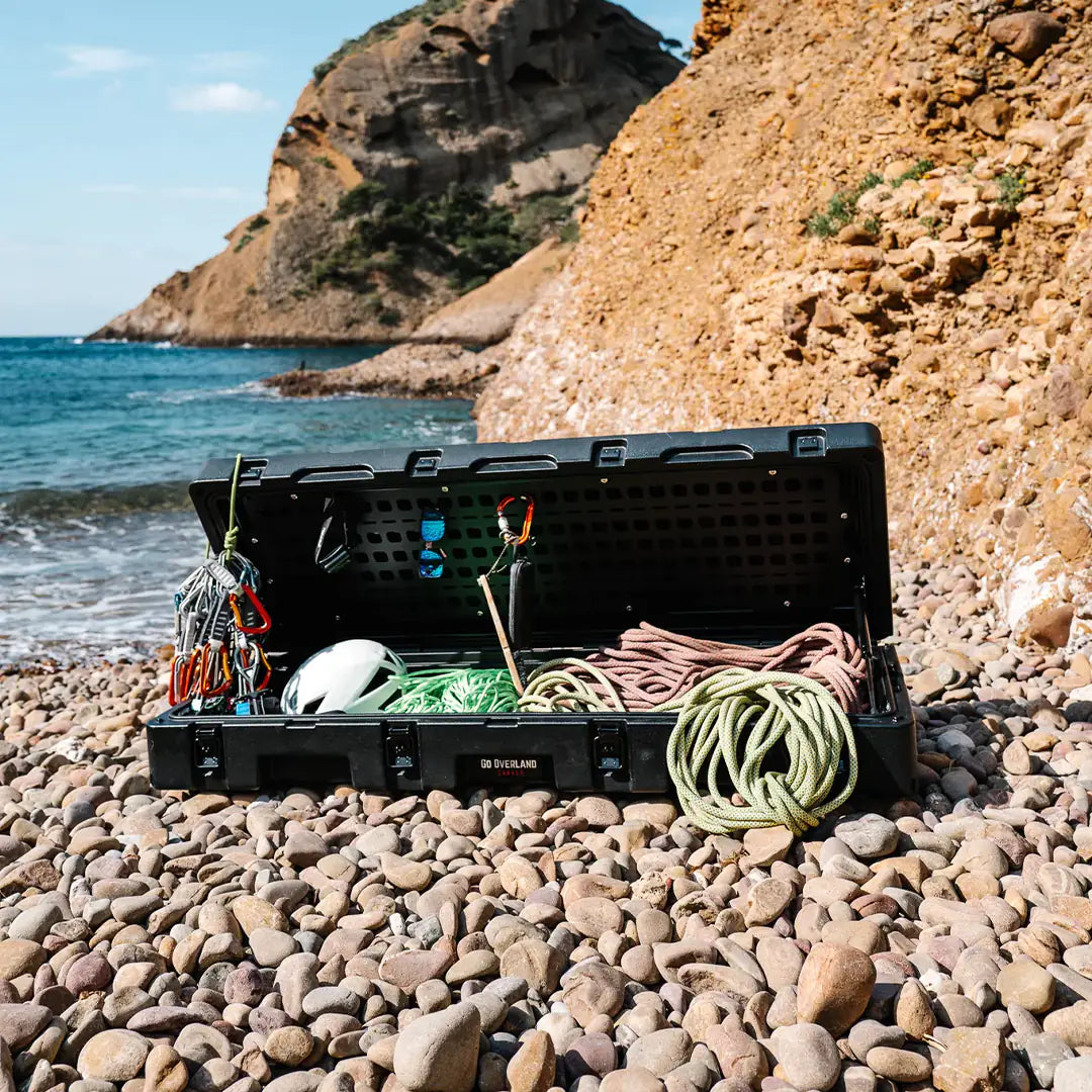 Rugged opened case on beach rocks