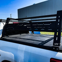 Close view of the bed rack on a Ram with bed cover