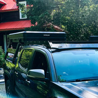 Front view with overland setup, roof tent and tacoma