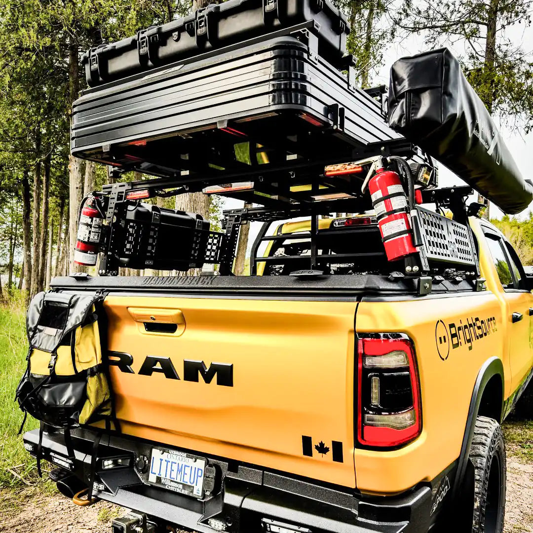 Rear view of the Truck Bed Rack with a Roof Top Tent an awning and all overlanding gear